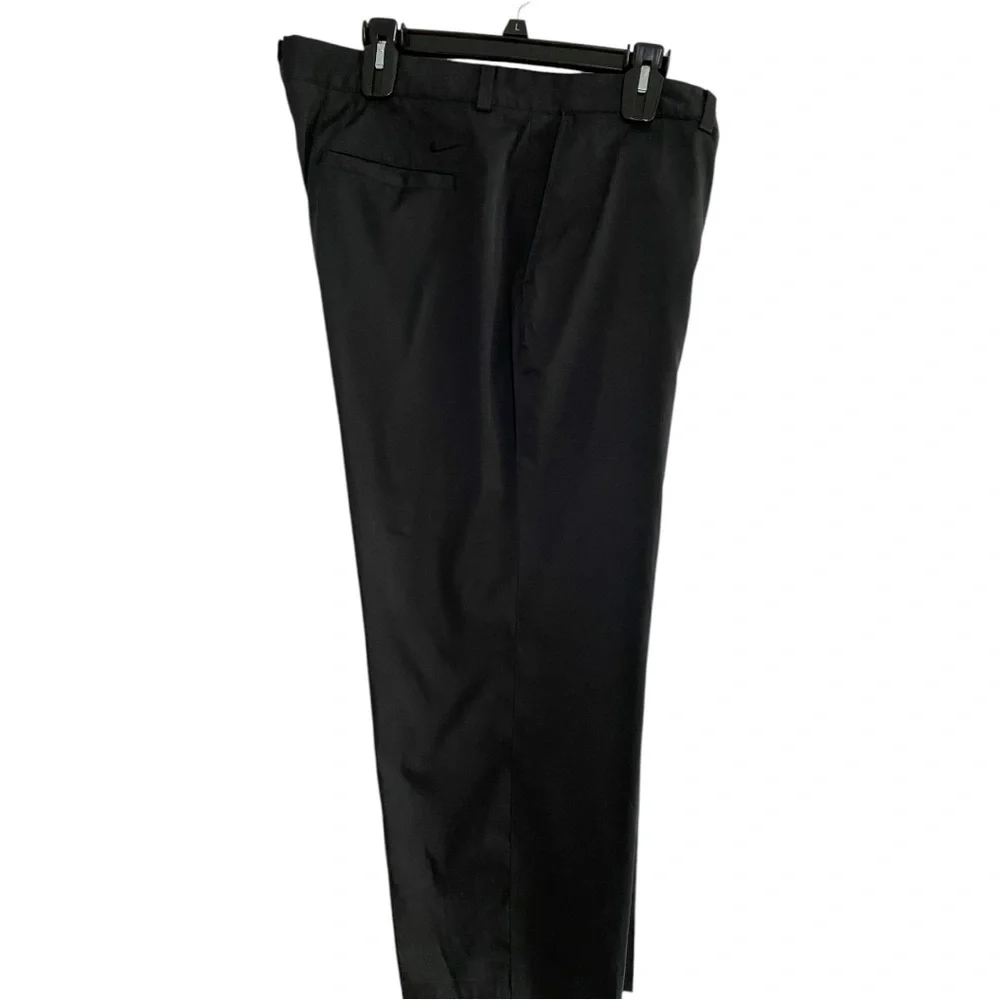 Nike Golf Tour Performance Dri-Fit black golf pants. Flat front Nike logo 40/26
